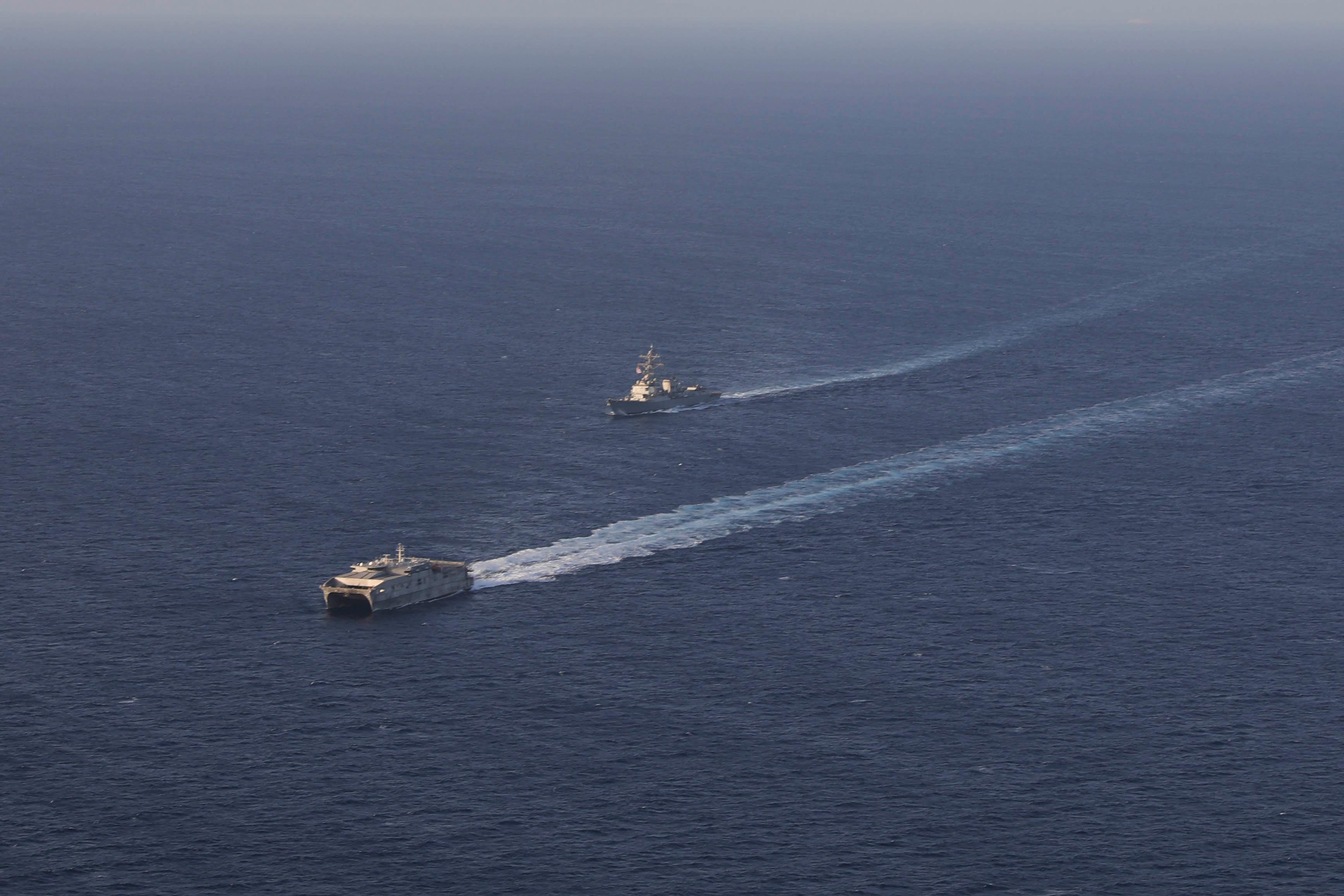 The Arleigh Burke-class guided-missile destroyer USS Truxtun (DDG 103), left, sails behind the Military Sealift Command expeditionary fast transport ship USNS Brunswick (T-EPF 6) in the Red Sea, May 1, 2023, while supporting the Department of State's efforts to evacuate U.S. citizens and others who have requested departure from Sudan.