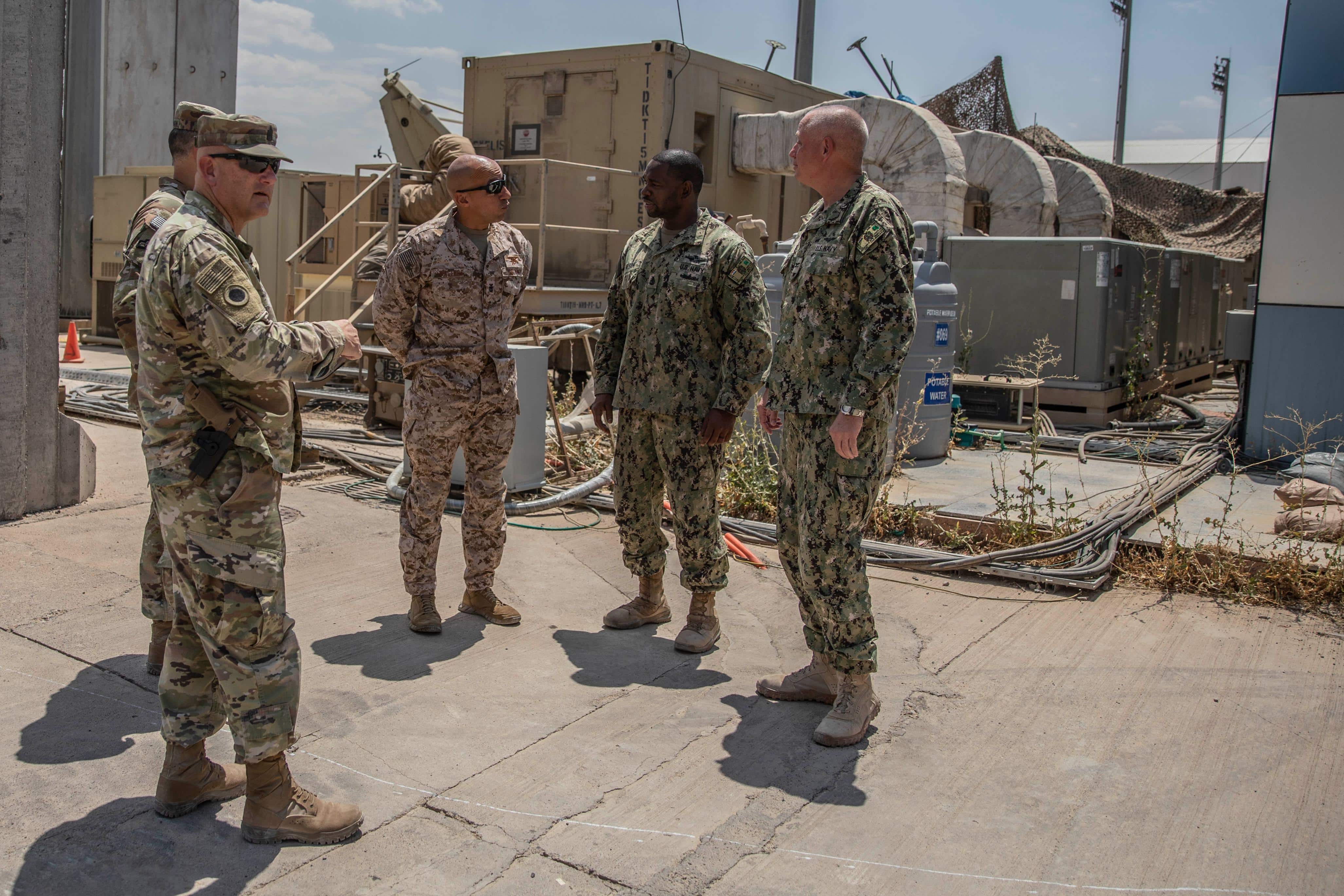 Fleet Master Chief Derrick "Wally" Walters, U.S. Central Command Senior Enlisted Leader, visits members of Combined Joint Task Force – Operation Inherent Resolve at Erbil Air Base, Erbil, Iraq, July 10, 2023. Service members from various nations provided insight to Walters on mission readiness within their ranks as well as morale and welfare at EAB. (U.S. Army Reserve photo by Staff Sgt. Christopher Jones)