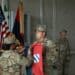 U.S. Army Capt. Brittany Belcher, the commander of the Headquarters and Headquarters Company, 3rd Division Sustainment Brigade, 3rd Infantry Division, and 1st Sgt. Angel Geigel, the unit’s senior enlisted leader, uncase their unit guidon during a transfer of authority ceremony in Powdiz, Poland, Aug. 6, 2023. The 3rd DSB has deployed from Fort Stewart, Georgia, to many areas in Europe in Support of Operations European Assure Deter and Reinforce.