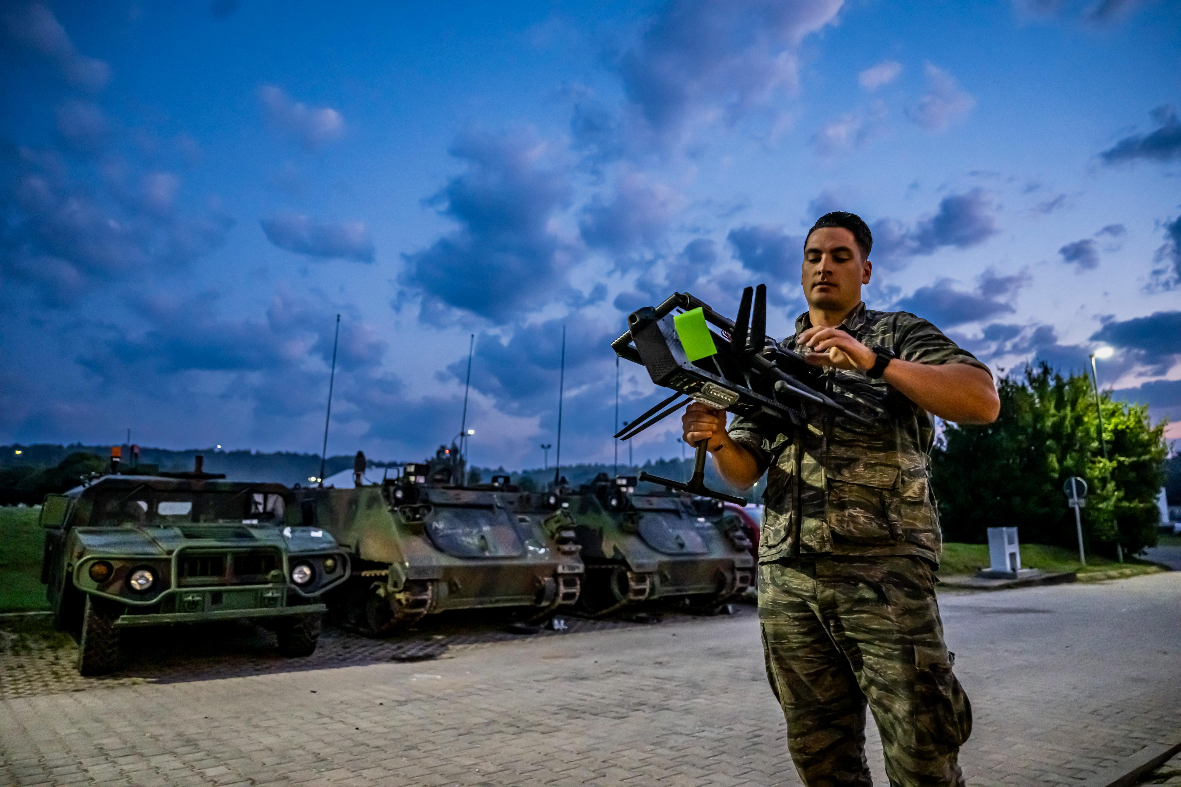 U.S. Army Sgt. Connor Piegaro, a Small Unmanned Aerial System master trainer with the 1st Battalion of the 4th Infantry Regiment, unfolds a TS-M800 II drone to demonstrate its capabilities during Saber Junction 23 at the Joint Multinational Readiness Center near Hohenfels, Germany, Sept. 11, 2023.