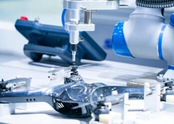 automatic robot drill machine tool at intelligence industrial manufacture computer factory