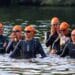 ST NEOTS, CAMBRIDGESHIRE, ENGLAND - SEPTEMBER 10, 2023: Womens Triathlon Competitors waiting at the start of swimming leg.