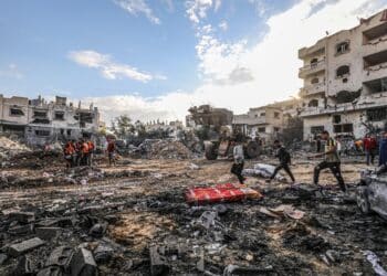 The Palestinian Civil Defense searches for survivors in a house for the Mukhaimir family and neighboring houses after an Israeli raid in the city of Rafah, south of the Gaza Strip, on October 17 2023.