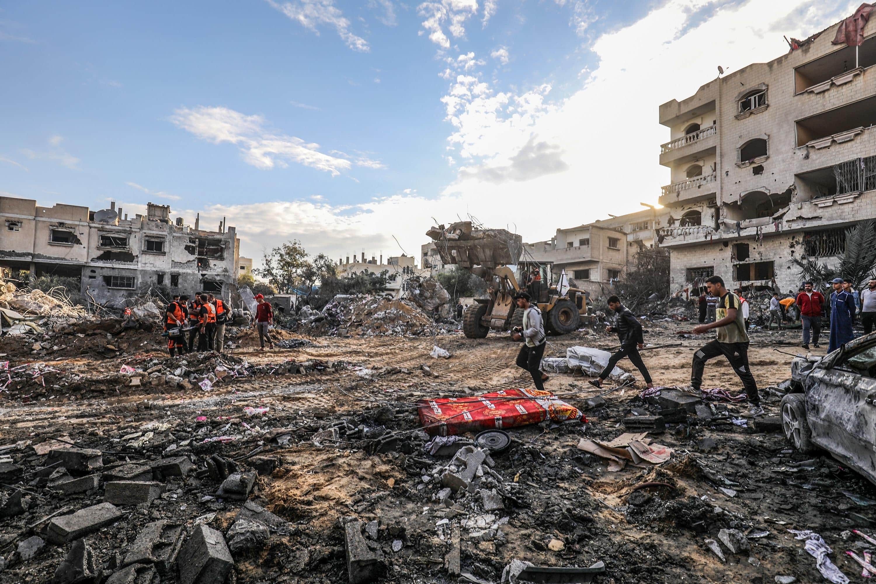 The Palestinian Civil Defense searches for survivors in a house for the Mukhaimir family and neighboring houses after an Israeli raid in the city of Rafah, south of the Gaza Strip, on October 17 2023.