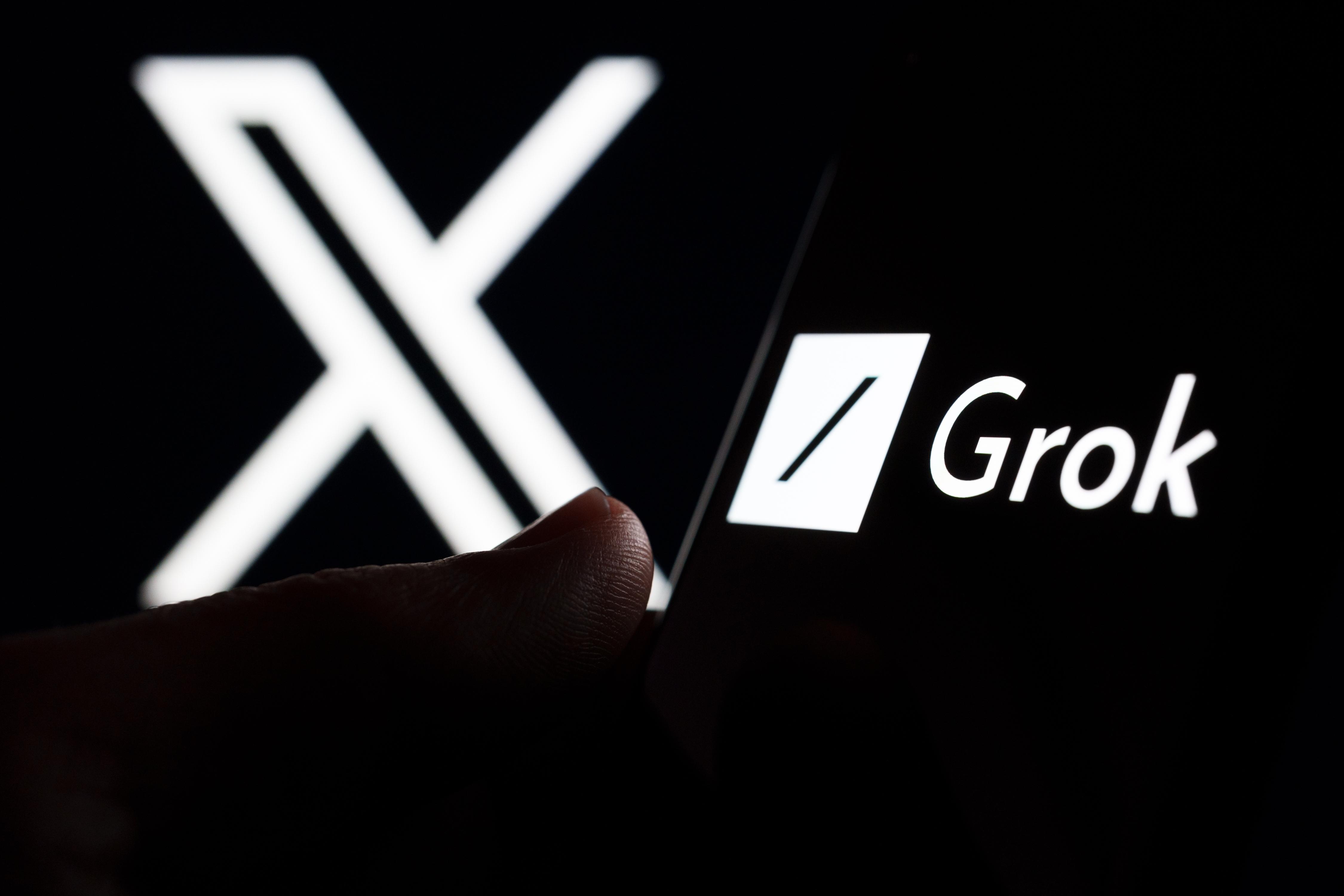 Grok AI chatbot logo seen on smartphone screen and finger pointing at it. Grok is a new chat bot for X platform. Stafford, United Kingdom, November 5, 2023