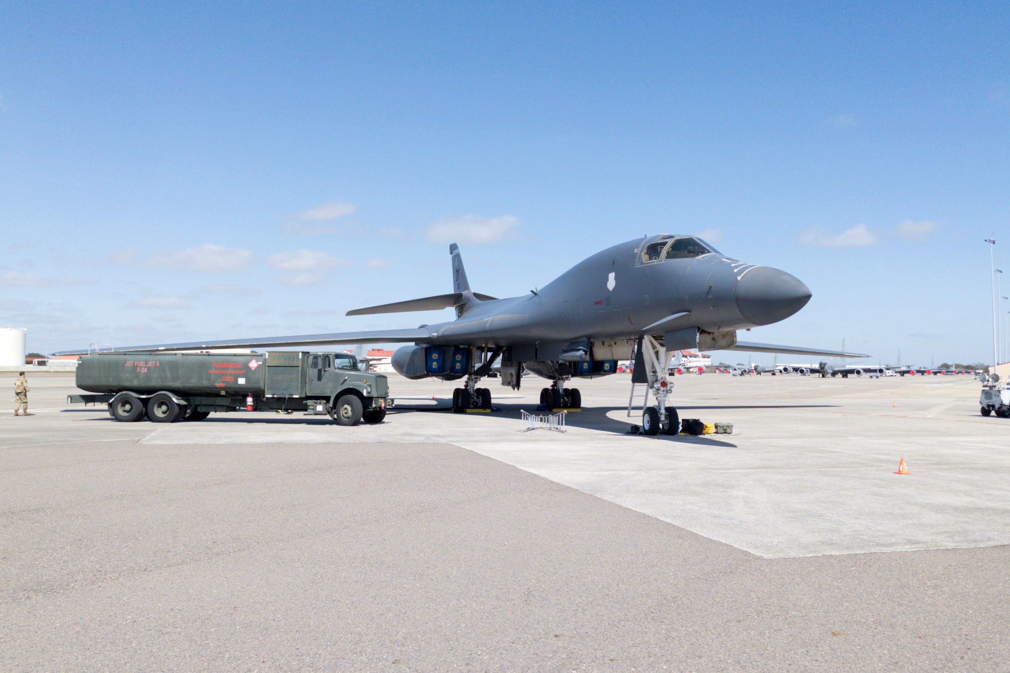 A B-1B Lancer aircraft assigned to Dyess Air Force Base, Texas is parked and unloading fuel into an R-11 fuel truck on the flight line at MacDill Air Force Base, Fla, Feb. 2, 2021.