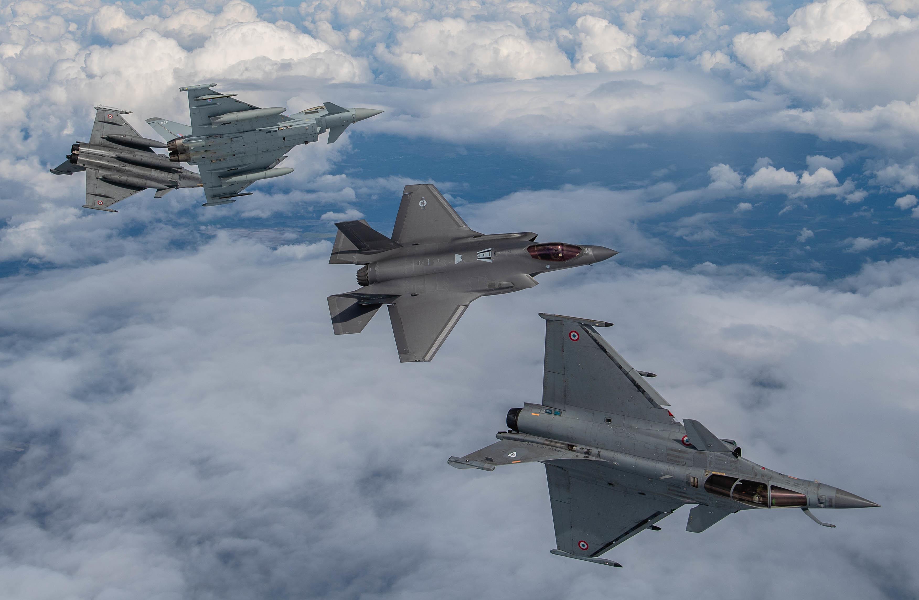 (A U.S. Air Force F-35A Lightning II, two Dassault Rafales and a Royal Air Force Eurofighter Typhoon break formation May 19, 2021, over France. The flight was apart of the Atlantic Trident 21 exercise which is a joint)