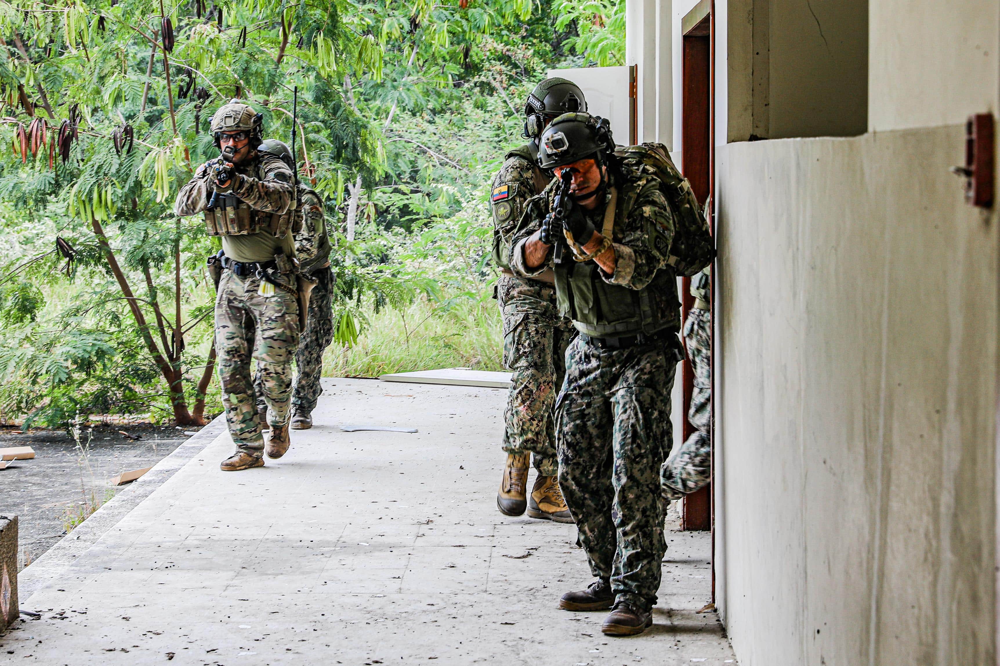 U.S. and Ecuadorian Special Forces breach and clear a shoot house during close quarter combat training for a culminating exercise in Ecuador on May 21, 2022. The overall exercise promotes military-to-military relationships, increases mission readiness, and improves regional security.