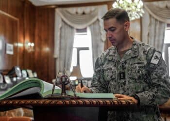 220803-A-YK067-2310 ALEXANDRIA, Egypt (Aug. 3, 2022) Vice Adm. Brad Cooper, commander of U.S. Naval Forces Central Command, U.S. 5th Fleet and Combined Maritime Forces, signs a guest book at the Egyptian Navy headquarters in Alexandria, Egypt, Aug. 3.