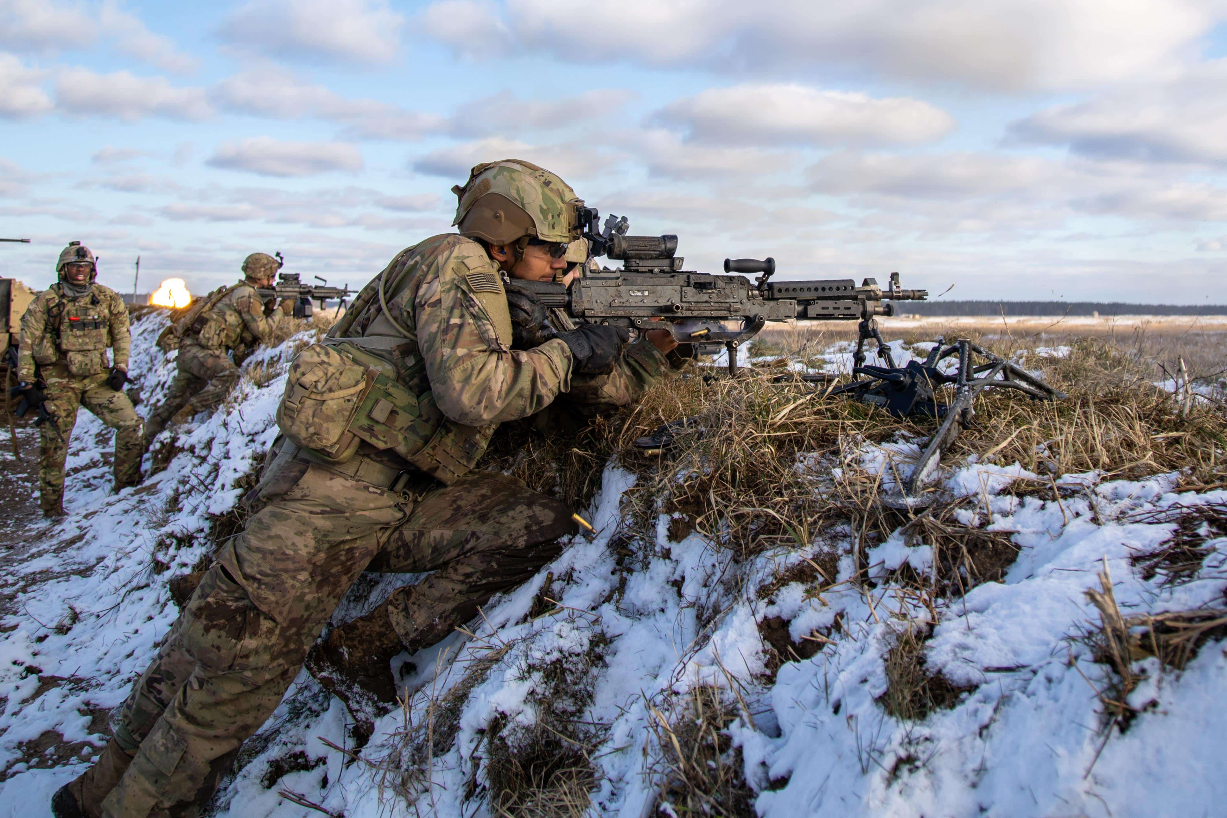 From left, U.S. Army Staff Sgt. Ramaud M. Pugh, an infantry squad leader, Pfc. Ryan M. Lofts and Spc. Payton G. Allen both infantry machine gunners, all assigned to NATO eFP Battle Group Poland, 2nd Armored Brigade Combat Team, 1st Cavalry Division, supporting the 4th Infantry Division