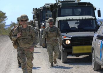 U.S. Army Soldiers assigned to the 1st Battalion, 182nd Field Artillery Regiment, Michigan National Guard, travel with Estonian and Latvian military personnel to the designated M142 High Mobility Artillery Rocket Systems launch site for a training exercise during a training exercise as part of Swift Response 23 in Undva, Estonia on May 14, 2023.