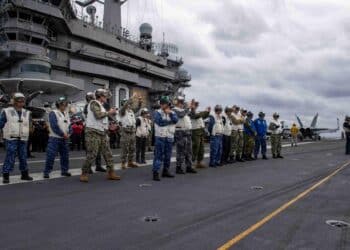 231111-N-TL932-1331 PHILIPPINE (Nov. 11, 2023) Senior leaders from Canada, Australia, Japan and U.S. navies observe flight operations on the flight deck aboard Nimitz-class aircraft carrier USS Carl Vinson (CVN 70) during Annual Exercise (ANNUALEX) 2023. ANNUALEX is a multilateral exercise conducted by naval elements of the Royal Australian, Royal Canadian