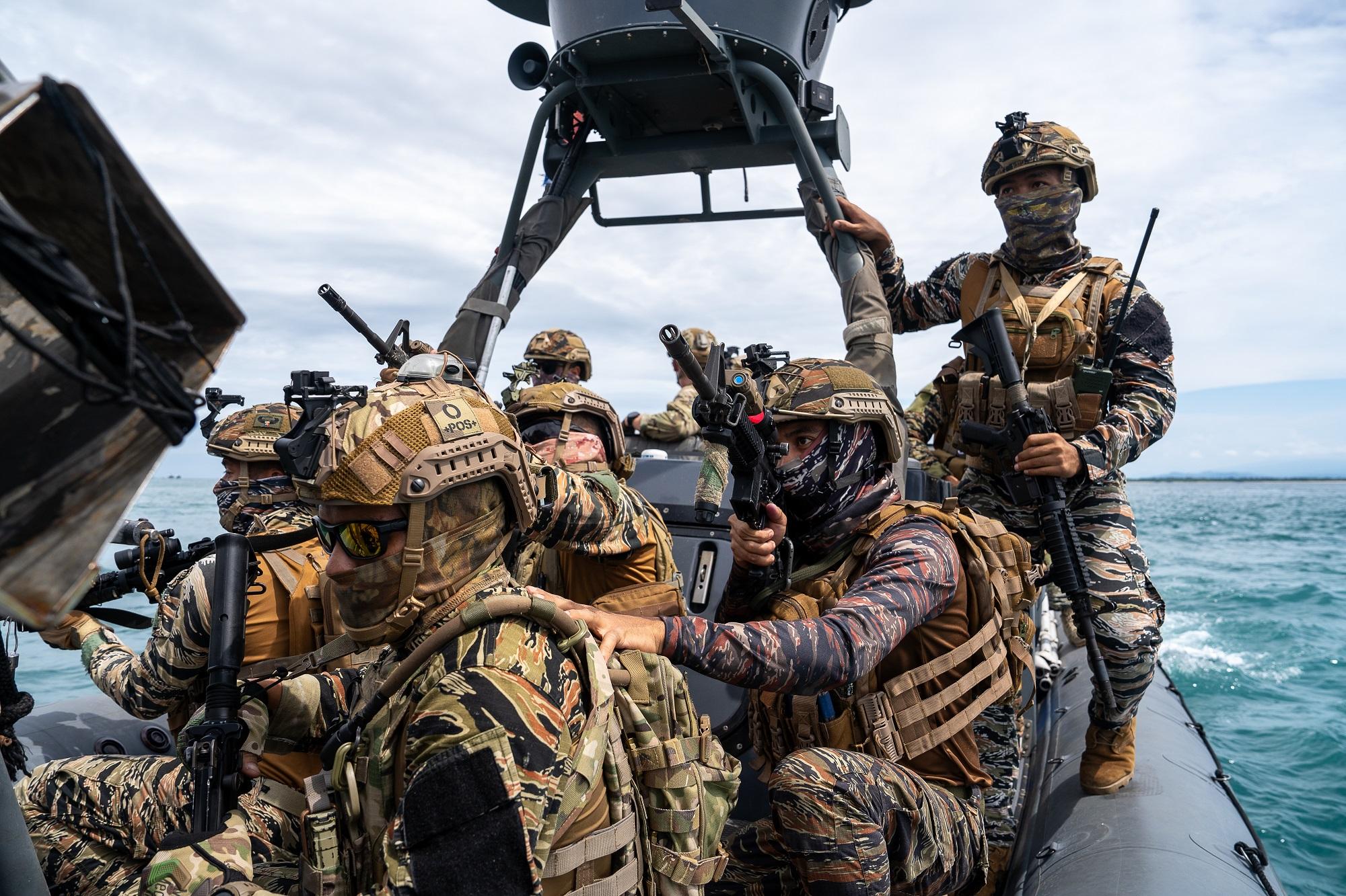 Service members form the Philippine Naval Special Operation Command and U.S. Special Operations Task Force 511.2 patrol in the Basilan Strait during a Joint Maritime Security Training Exercise conducted throughout the Sulu Archipelago, Philippines, Nov. 22, 2023.