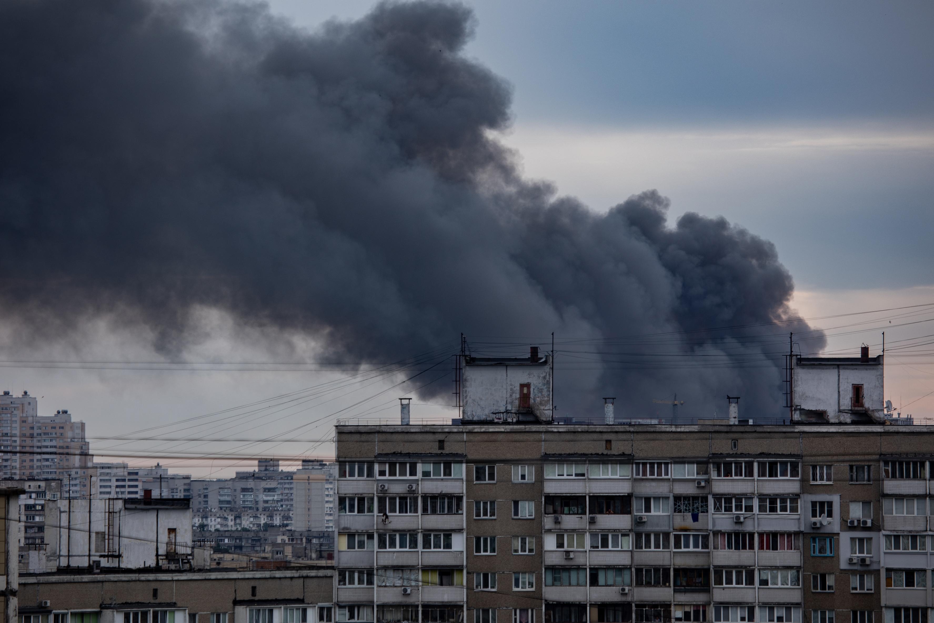 KYIV, UKRAINE - JUN 05, 2022: Kyiv rocked by blasts from Russian cruise missiles. Smoke rises over residents houses after missile strikes, as Russia's attack on Ukraine continues, in Kyiv, Ukraine.