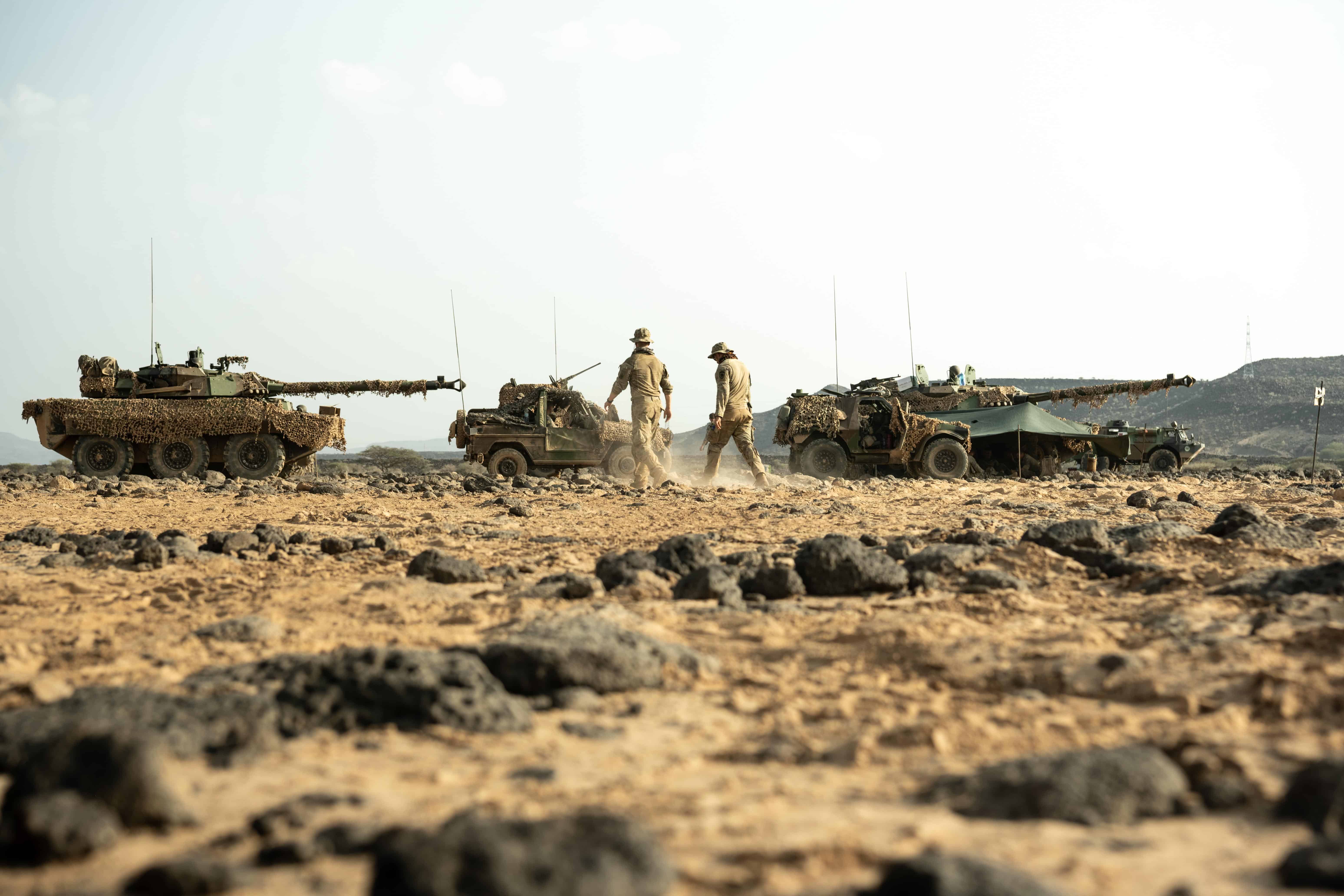U.S. service members with Combined Joint Task Force - Horn of Africa walk among French tanks and lightweight tactical vehicles as part of the French Desert Commando Course (FDCC) at the Djiboutian Range Complex, Djibouti, Sept. 13, 2021. During FDCC, U.S.