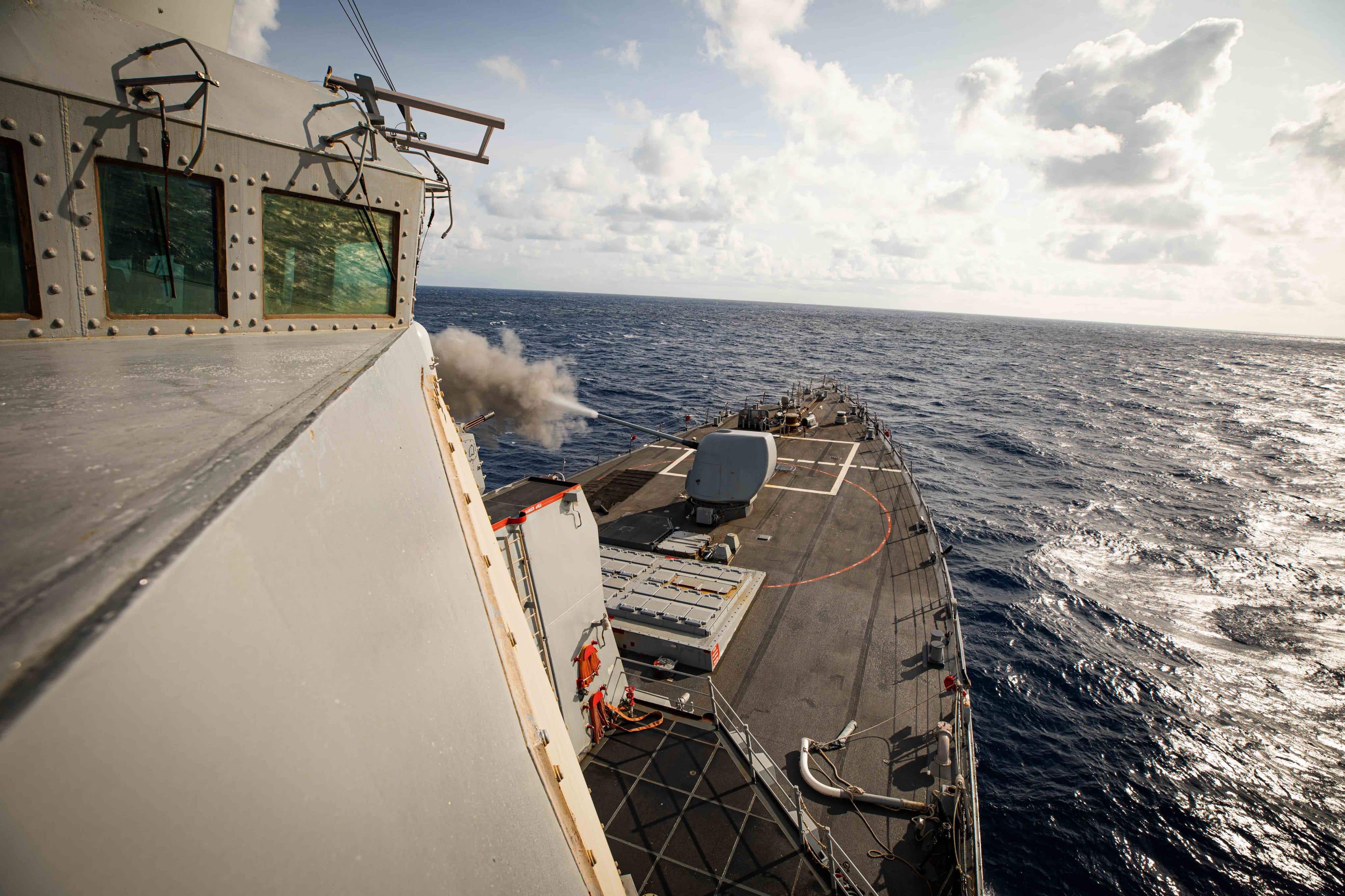 ATLANTIC OCEAN (Oct. 3, 2023) The Arleigh Burke-class guided-missile destroyer USS Carney (DDG 64) fires the Mark 45 5-inch gun during a pre-action calibration firing (PACFIRE) in the Atlantic Ocean, October 3, 2023. Carney is on a scheduled deployment in the U.S. Naval Forces Europe area of operations, employed by the U.S. 6th Fleet, and U.S. 5th Fleet to defend U.S., allied and partner interests. (U.S. Navy photo by Mass Communication Specialist 2nd Class Aaron Lau)
